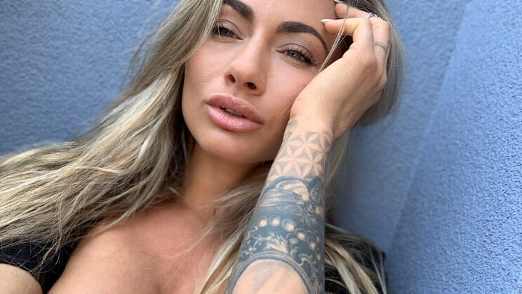 Pierced and Tattooed, She Masturbates